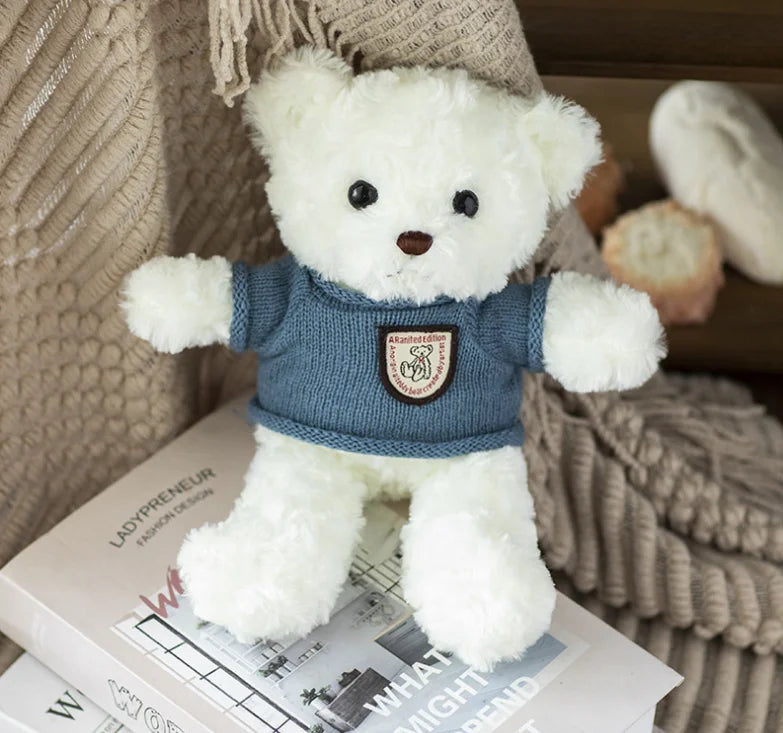 Kanye West varsity custom icon plushie, 26cm bear in a white and grey varsity jacket over a graphic tee, view 12