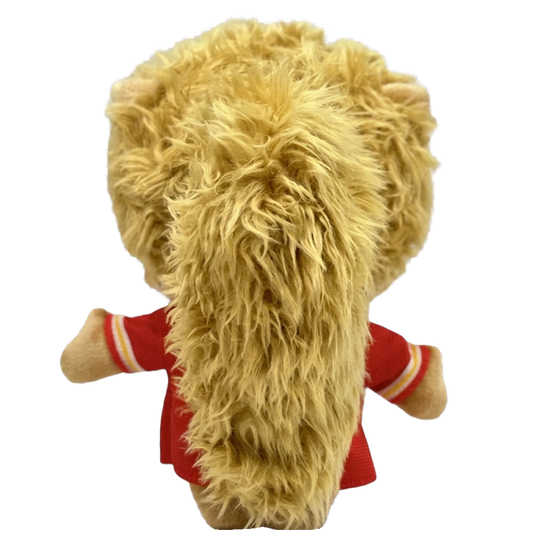 THE SWIFT pop plush collectible — soft sculpture showing voluminous golden-blonde curly hair and signature lash detailing