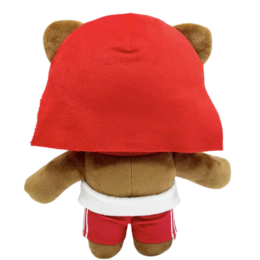 THE SKEE rapper plush collectible — red textile hair, black-rimmed eyewear and drawstring shorts, hip-hop icon display figure