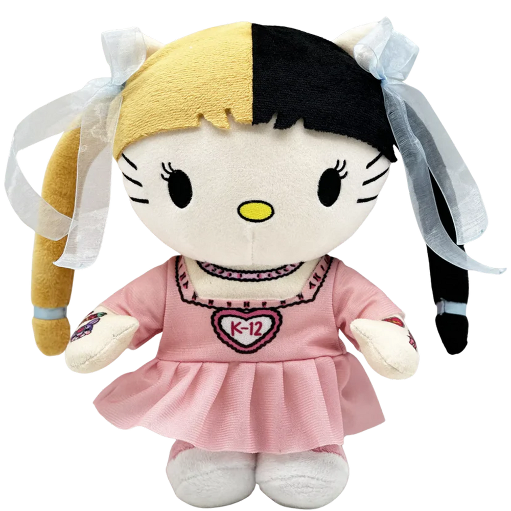 THE K-12 pop plush collectible, soft sculpture in pastel pink ruffled dress with heart K-12 branding