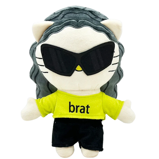 THE BRAT pop plush collectible — soft sculpture figure with high-chroma green cropped tee and charcoal wavy hair