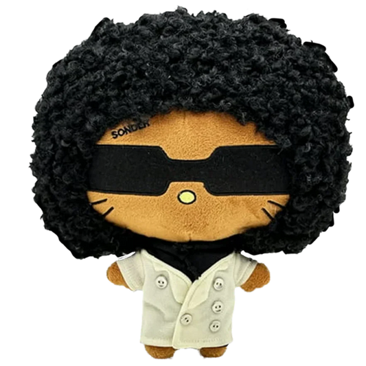 THE DEAD MAN R&B plush collectible — soft sculpture figure with off-white double-breasted peacoat and high-volume charcoal hair