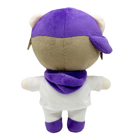 THE DREW pop plush collectible — soft sculpture showing high-chroma purple side-facing cap and jagged ash-blonde hair