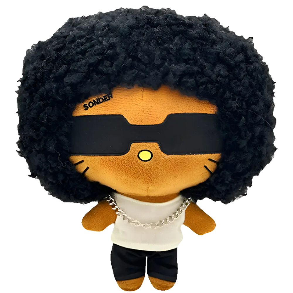 THE SONDER R&B plush collectible, soft sculpture with high-volume curly hair, matte-black eyewear and silver Cuban link chain